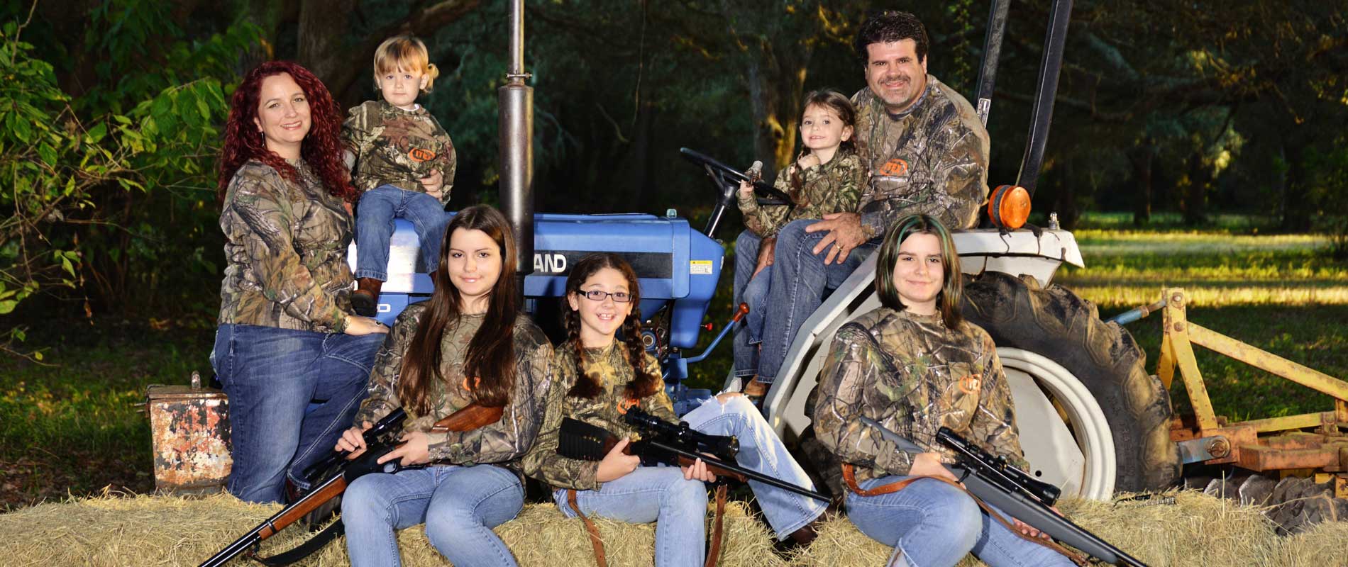 A Hunting Family In Camoflage With Guns-Deer Hunting Alabama-Rock Bottom Ranch 1831 Rocky Hill Rd Uriah Al 36480 251-233-9720