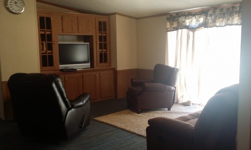 A Living Room With A TV-Deer Hunting Alabama-Rock Bottom Ranch 1831 Rocky Hill Rd Uriah Al 36480 251-233-9720